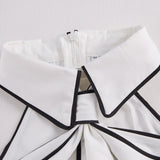 Stylish Sleeveless Halter Neck Blouse With Bold Contrast Trim