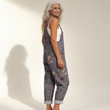 Jumpsuit - Gray jumpsuit with a bright floral pattern in dark with flowers